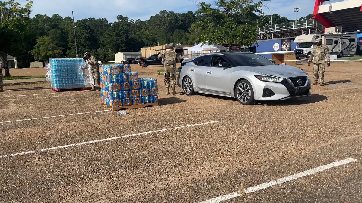 People lining up to get water