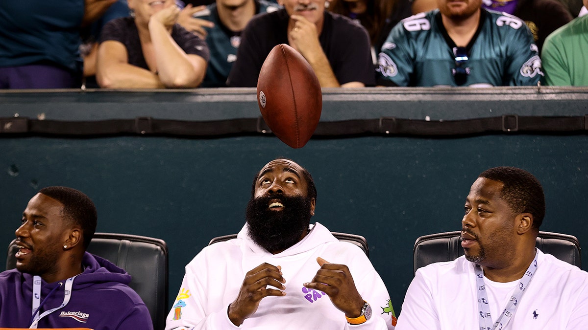 James Harden tosses the ball