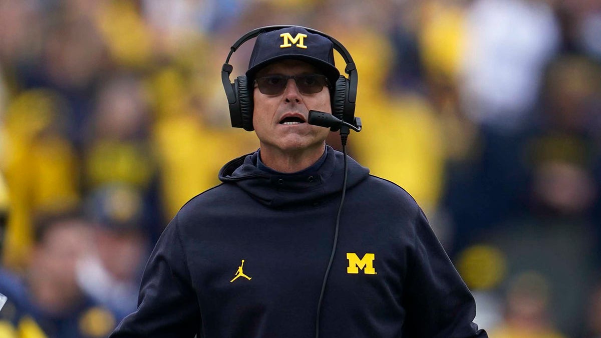 Head Coach Jim Harabaugh watches from the sidelines