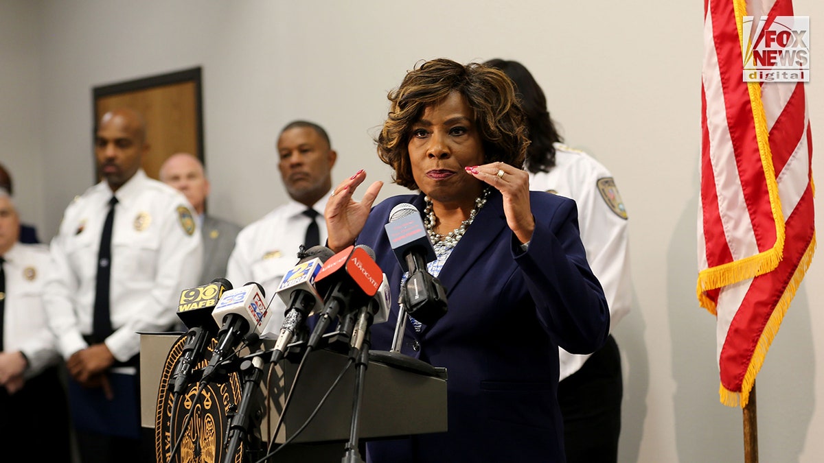 Baton Rouge Mayor Sharon Weston Bloom stands at a podium during a press conference 