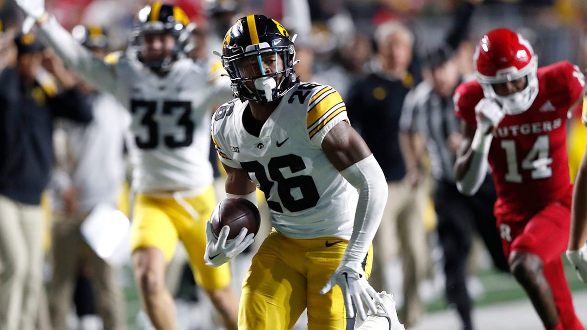 Iowa player returns a fumble for a touchdown