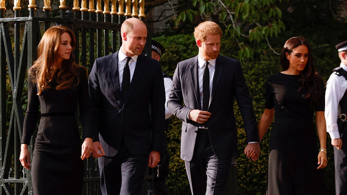 Britain's William, Prince of Wales, Catherine, Princess of Wales, Britain's Prince Harry and Meghan, the Duchess of Sussex, are seen outside Windsor Castle