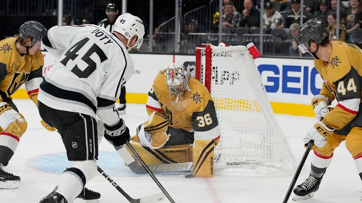 Goaltender Logan Thompson blocks a shot