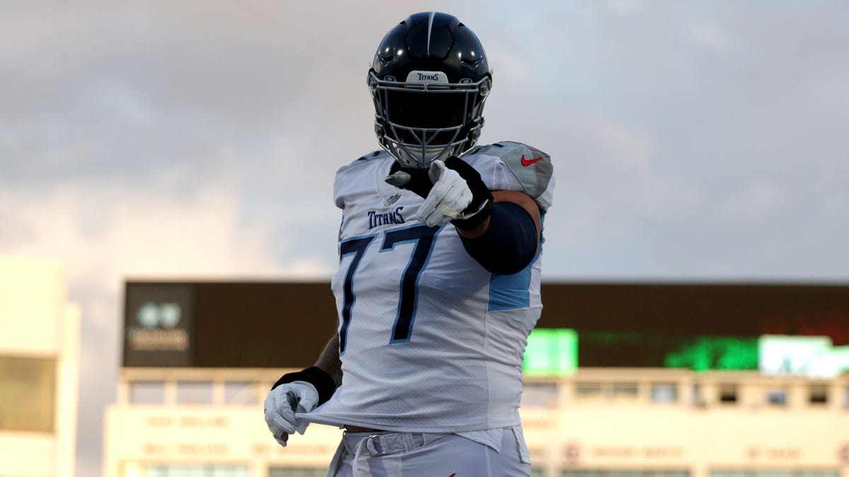 Taylor Lewan points at camera