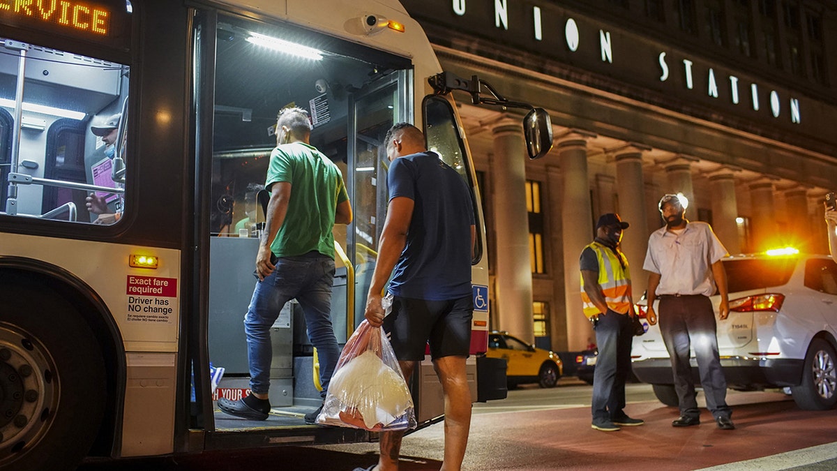 Migrants board NYC bus