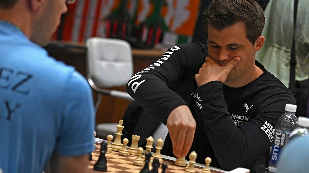Magnus Carlsen: FIDE reprimands world champion for quitting match after one  move but 'shares his deep concerns' about cheating in chess