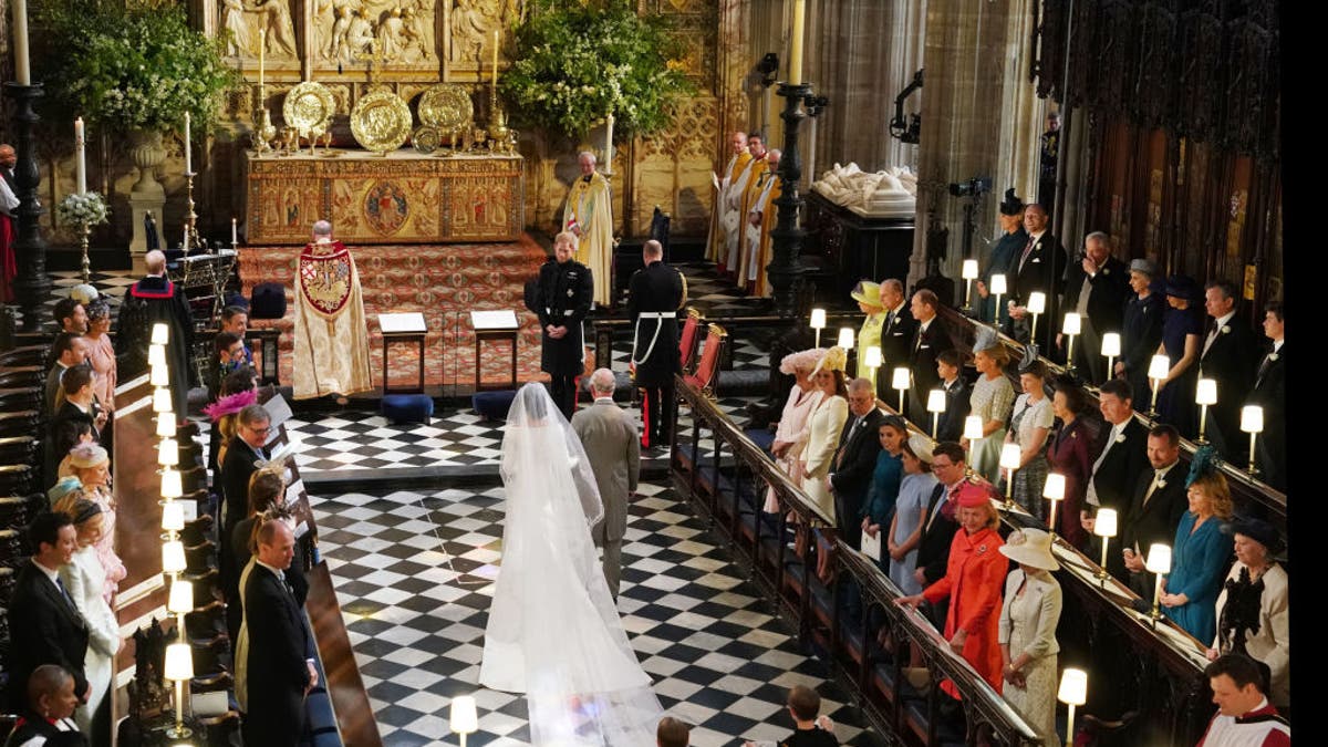 Charles walks Meghan Markle down the aisle