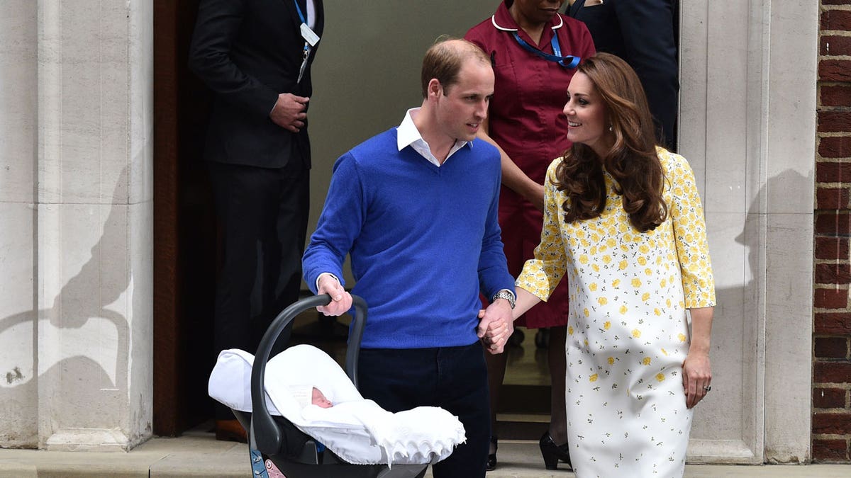 Kate Middleton and Prince Harry with their baby