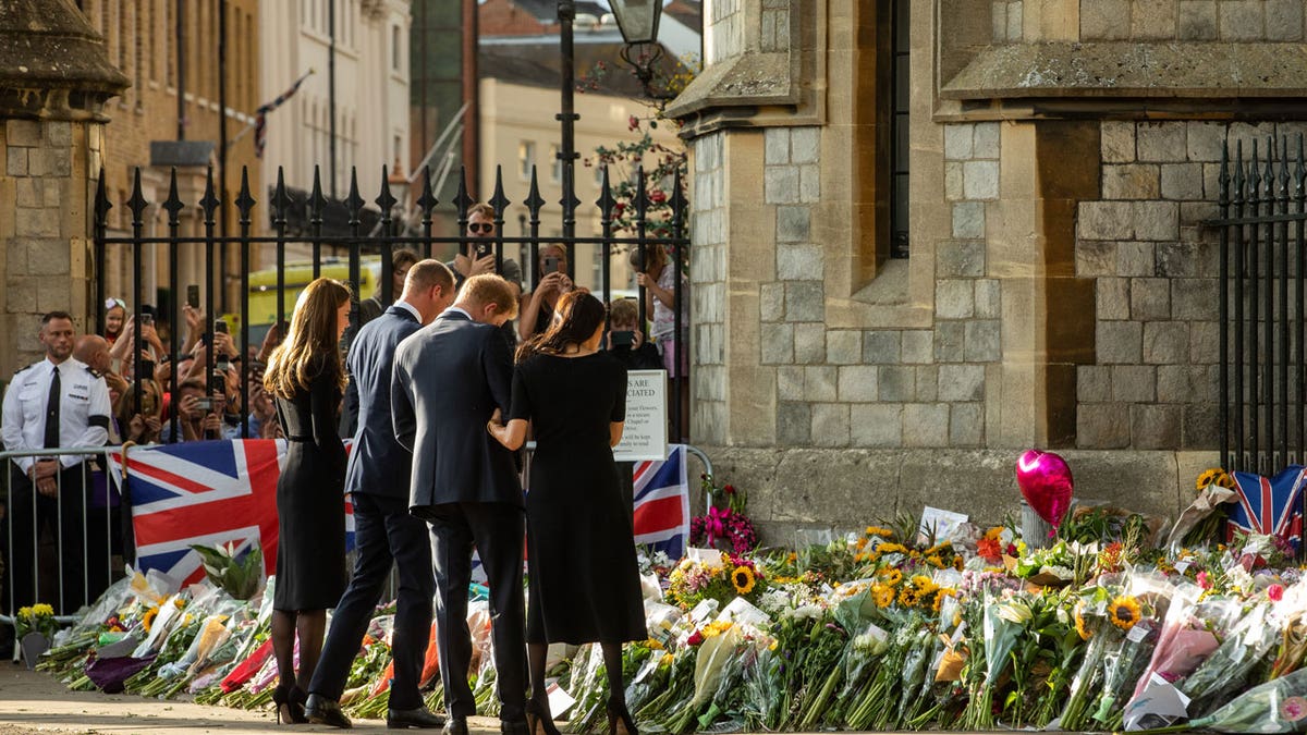Kate Middleton, Prince William, Prince Harry and Meghan Markle view floral tributes