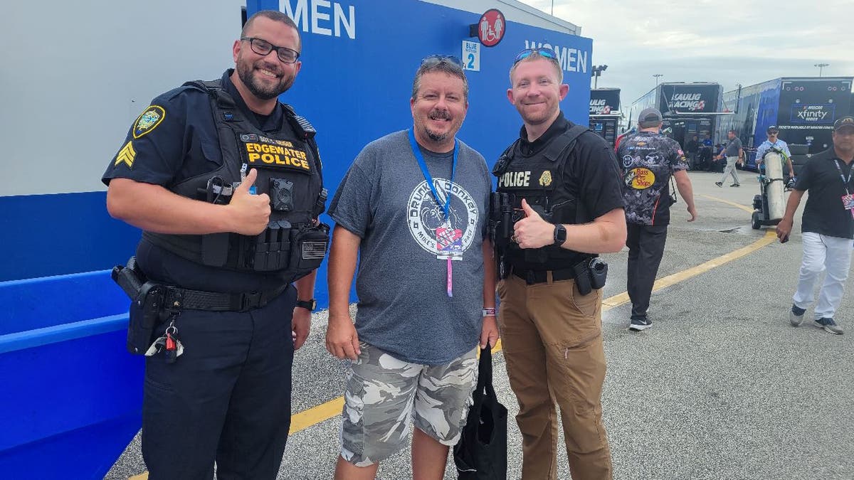 Mike Boylan poses with cops