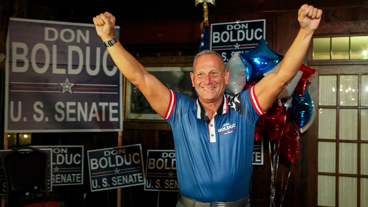 Republican Senate candidate Don Bolduc reacts during a primary night election party in New Hampshire