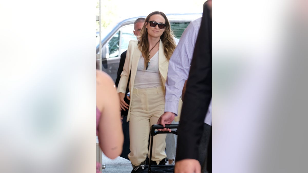 Olivia Wilde lands at airport in Italy.