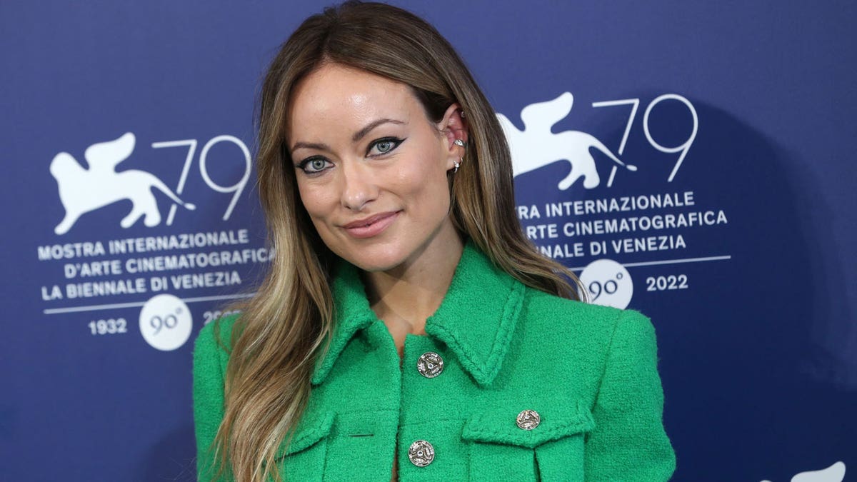 Olivia WIlde attends a press conference in Venice