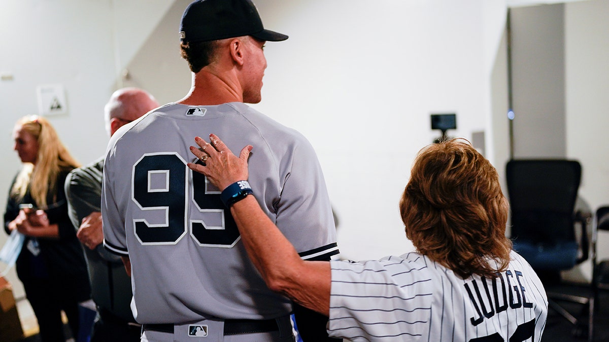 Aaron Judge walks with his mom