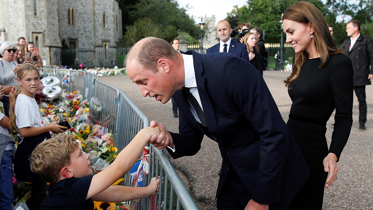 William, Prince of Wales, and Catherine, Princess of Wales, greet crowds outside Windsor Castle after Queen Elizabeth's death