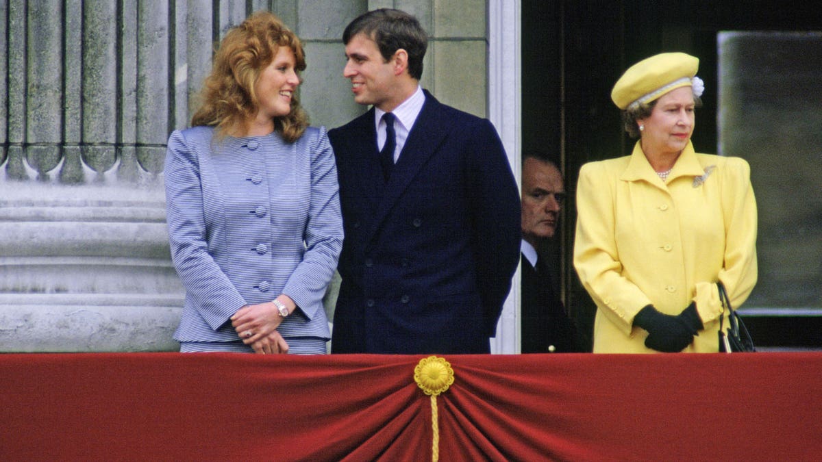 Sarah Ferguson, Prince Andrew and Queen Elizabeth II on the balcony at Buckingham Palace