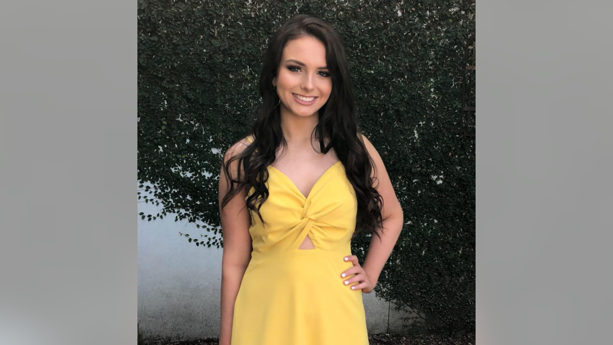 Allison "Allie" Rice wearing a yellow dress