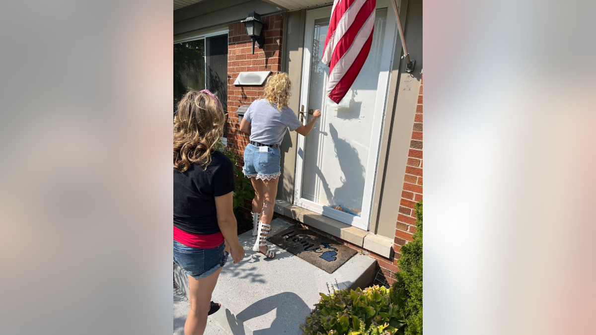 Photo shows women knocking on a door to discuss a ballot measure 