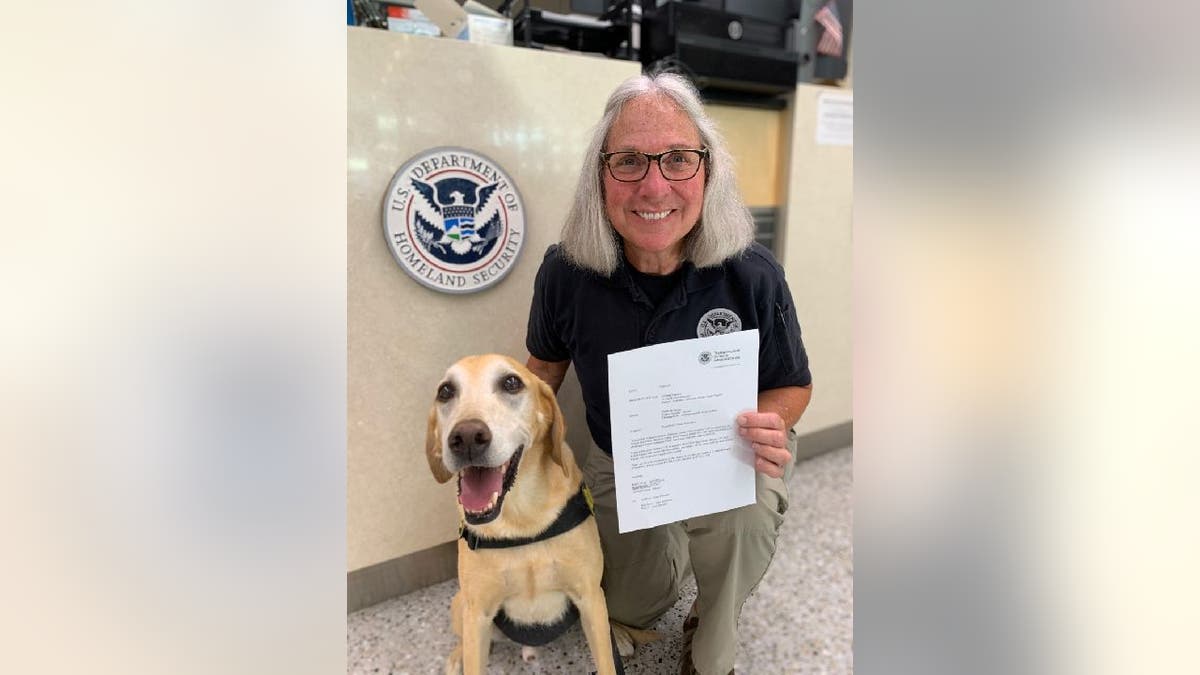 TSA dog Eebbers and TSA retiree Jean Carney