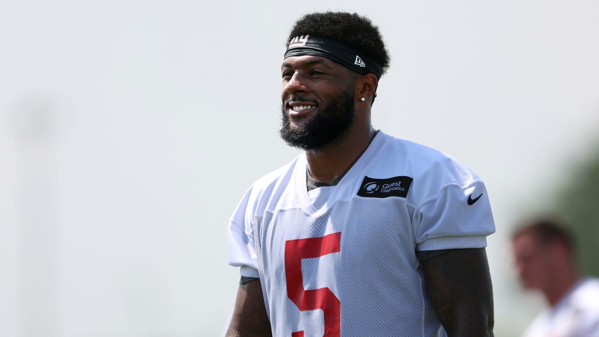 Kayvon Thibodeaux smiles during practice