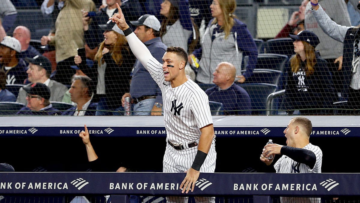 Aaron Judge celebrates in dugout