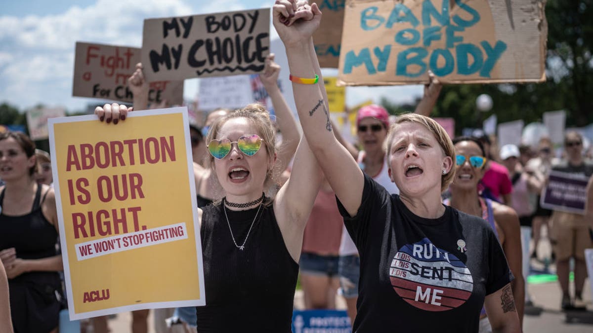 Abortion protesters holding signs