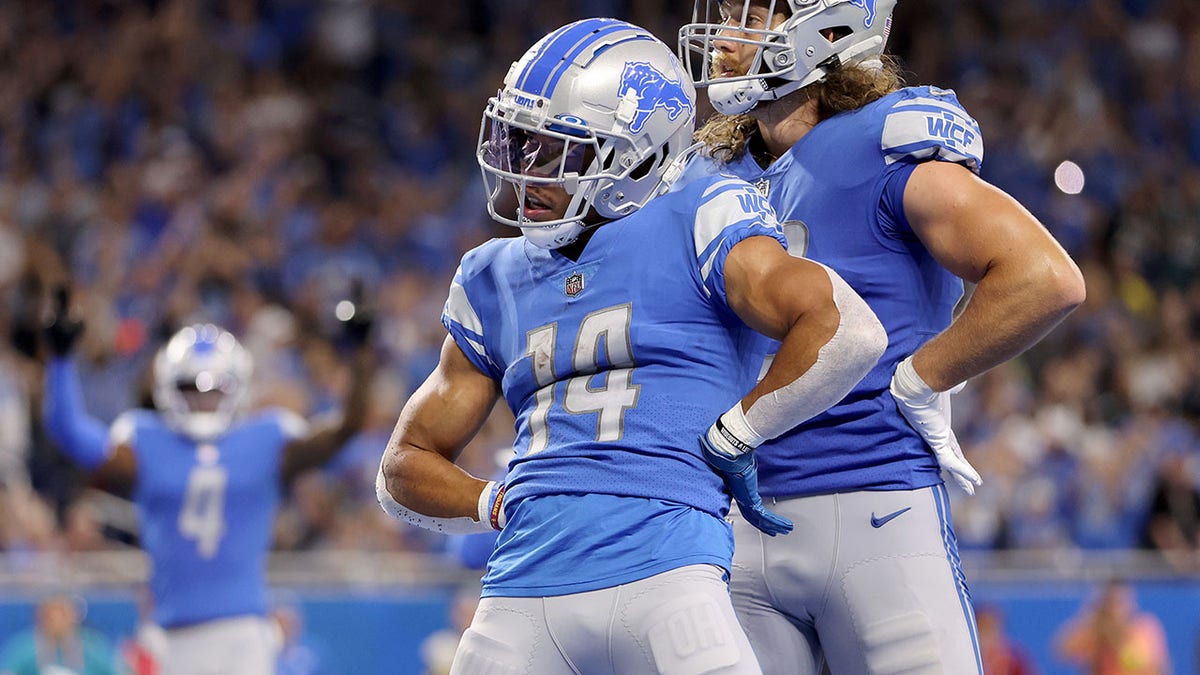 Amon-Ra St. Brown, Aidan Hutchinson lead Lions to first win