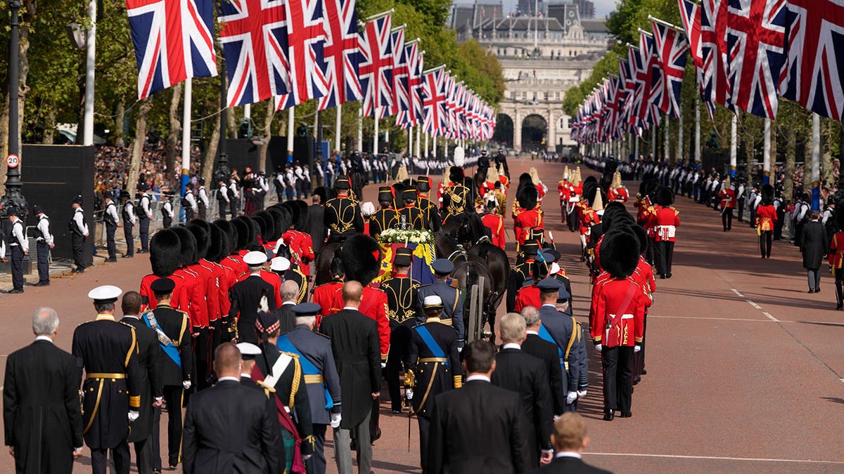 Queen Elizabeth's coffin is followed by Senior Royals and guards