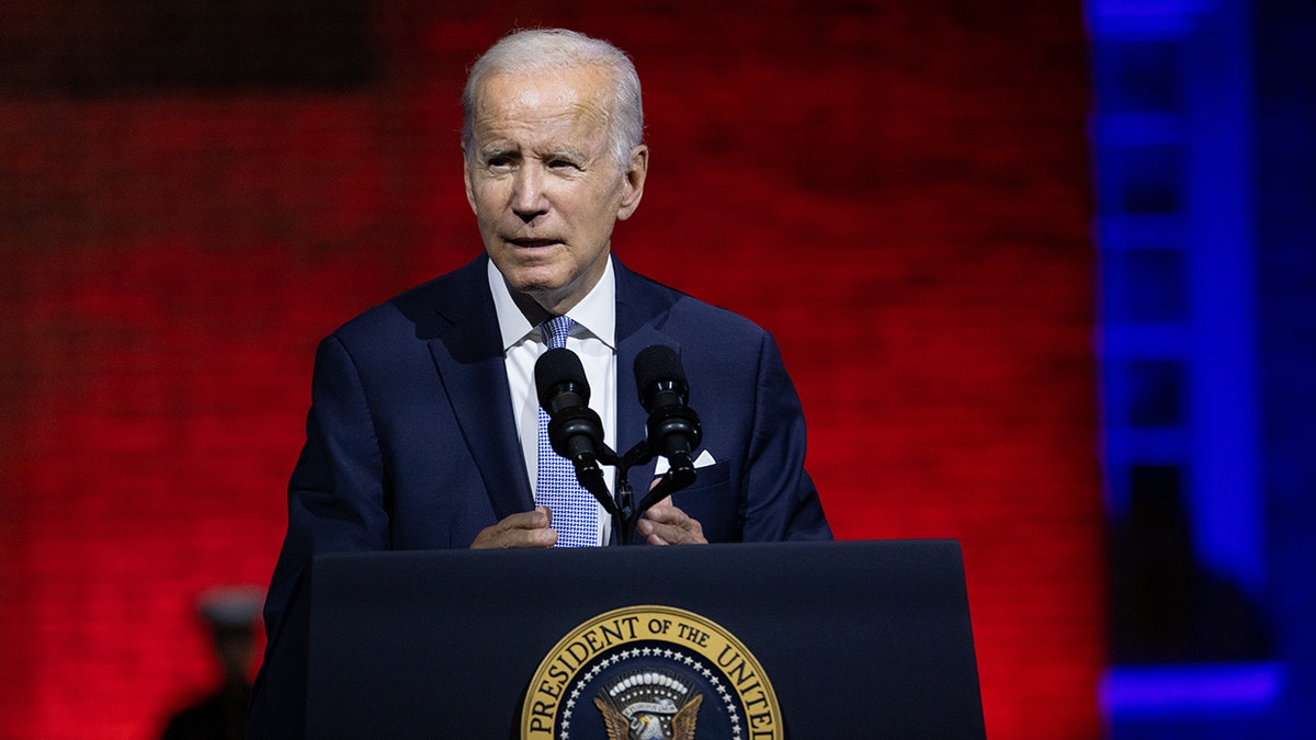 President Biden gives a speech at a podium