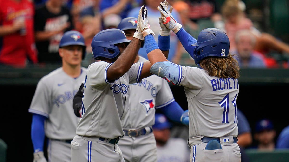 Bo Bichette celebrates with teammates