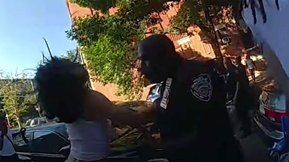 NYPD bodycam of cop striking 19-year-old woman interfering in arrest