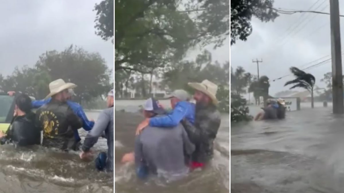 Good Samaritans carry elderly man to safety through flood