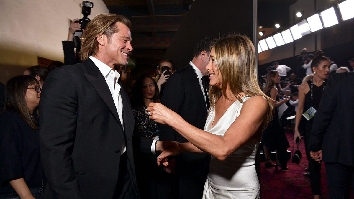 Brad Pitt and Jennifer Aniston saying hello in 2020