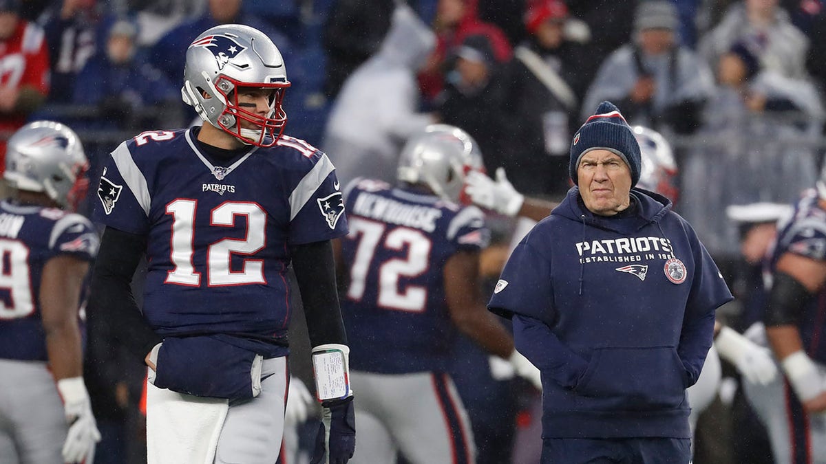 Tom Brady walks away from Bill Belichick