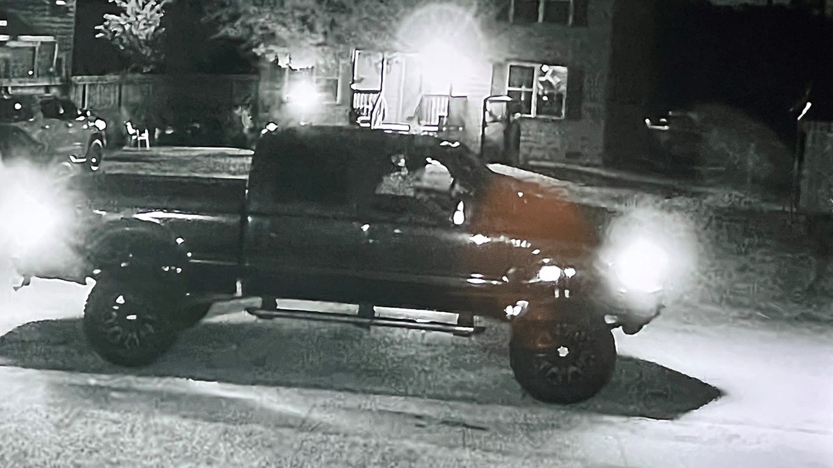 A black-and-white photo of a truck