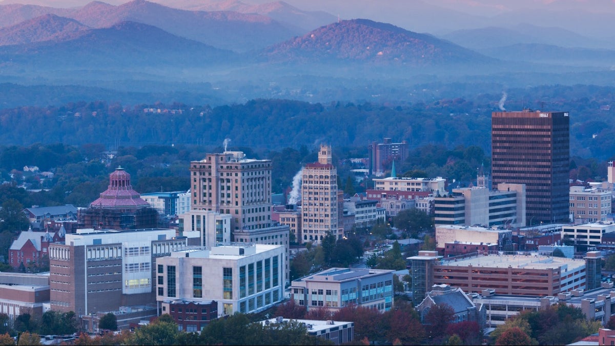 A view of the Asheville, North Carolina skyline at dawn.