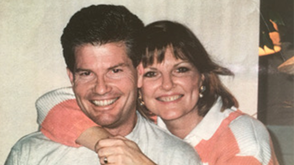 Photo shows Debra Burlingame with her brother Chic while they smile at the camera in 1991