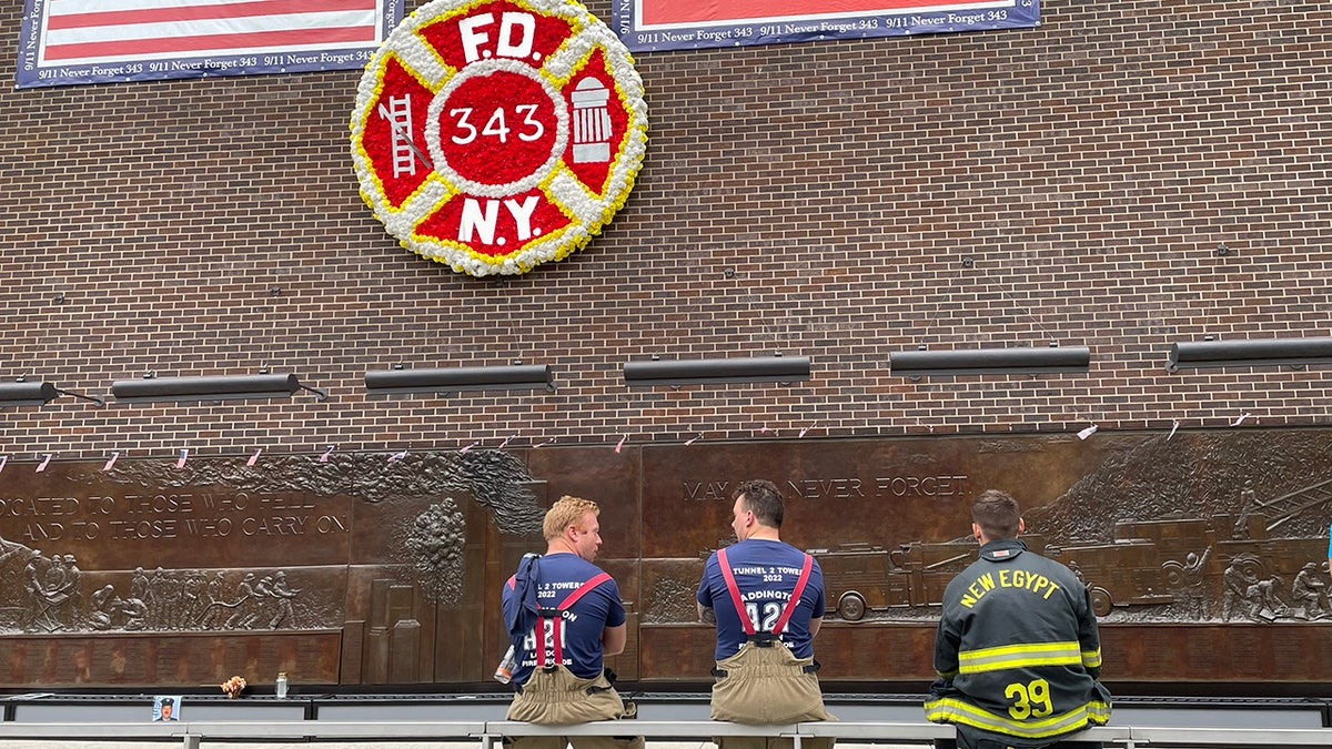 firefighters at fdny wall