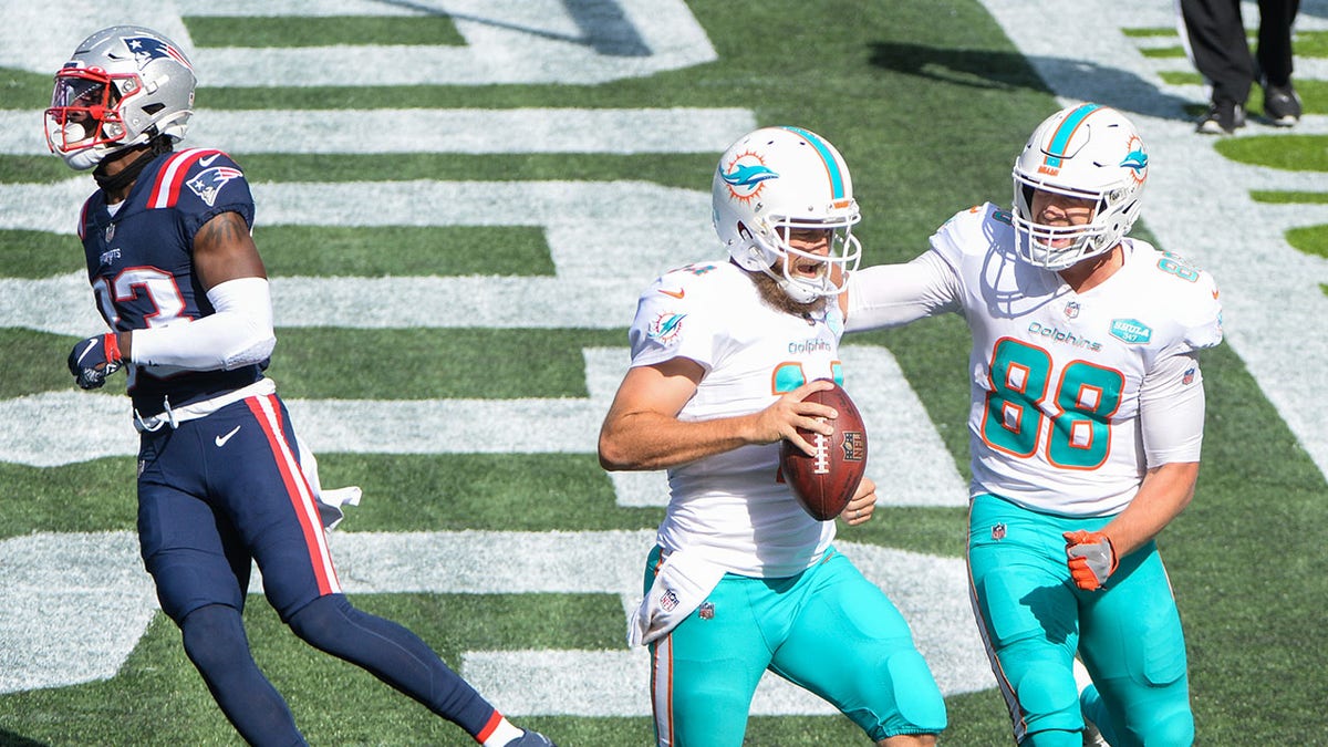 Ryan Fitzpatrick of the Miami Dolphins warms up prior to the game