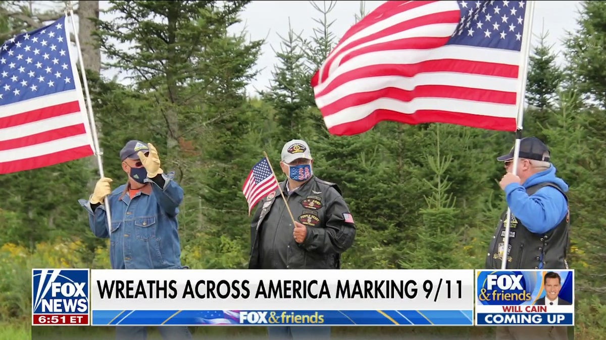 men holding american flags