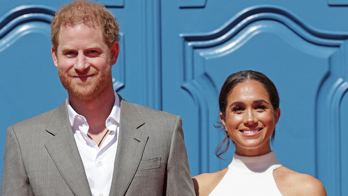 Prince Harry, Meghan Markle smiling