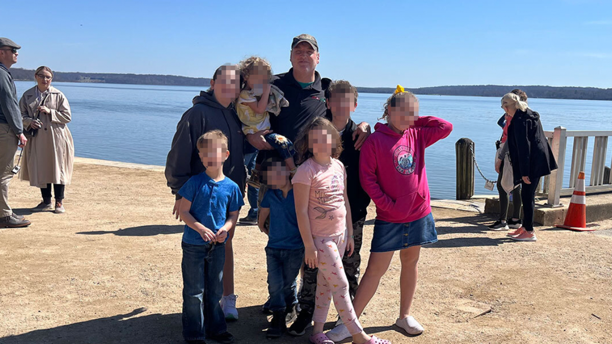Mark Houck with his family near a beach