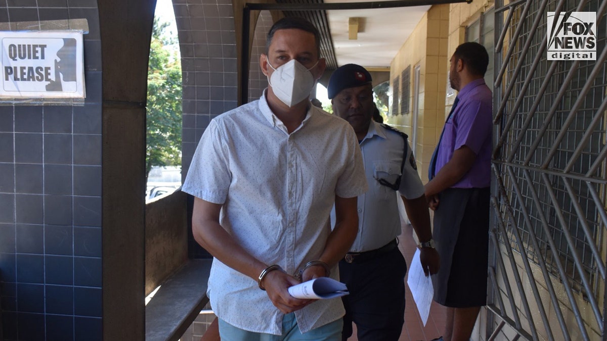 Bradley Robert Dawson, 39, is escorted back to the cellblock at the High Court in Lautoka, Fiji, on Monday, Sept. 25, 2022. The Tennessee IT specialist accused of murdering his wife Christe Chen Dawson on their honeymoon in Fiji in July of this year.