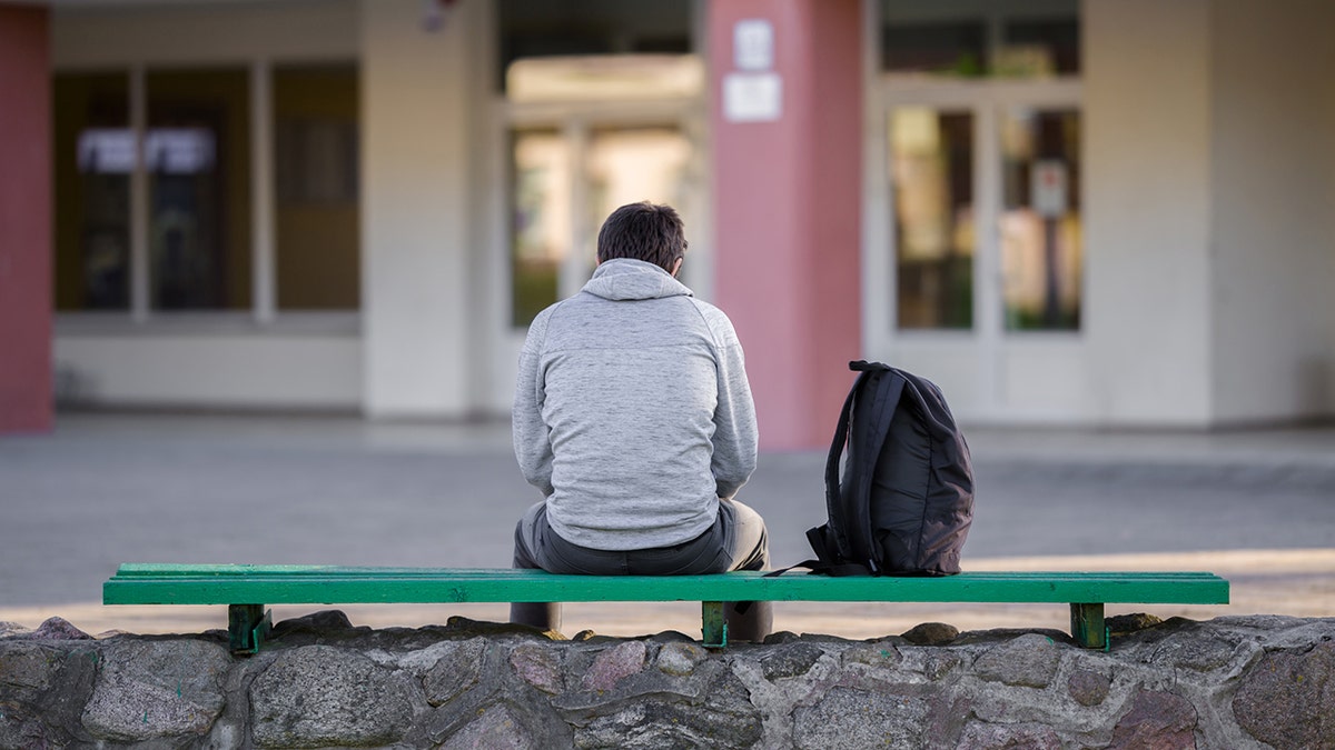 young student sits