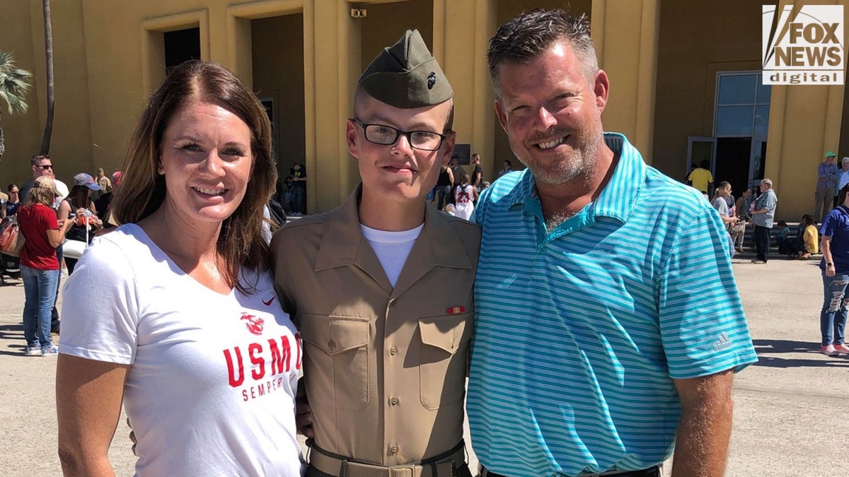 Marine Lance Cpl. Jared Schmitz and his parents