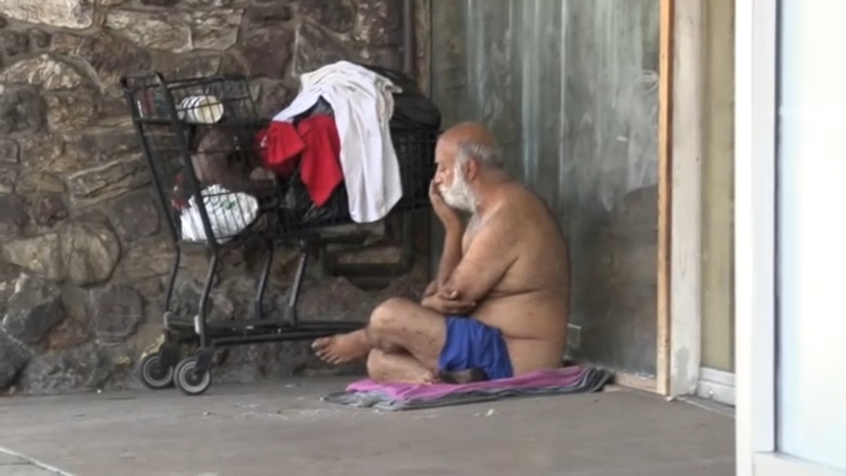 LA homeless man by cart