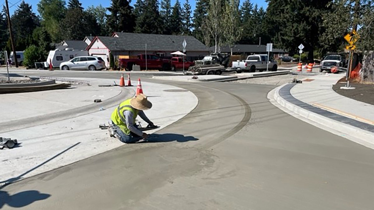 worker smoothing concrete