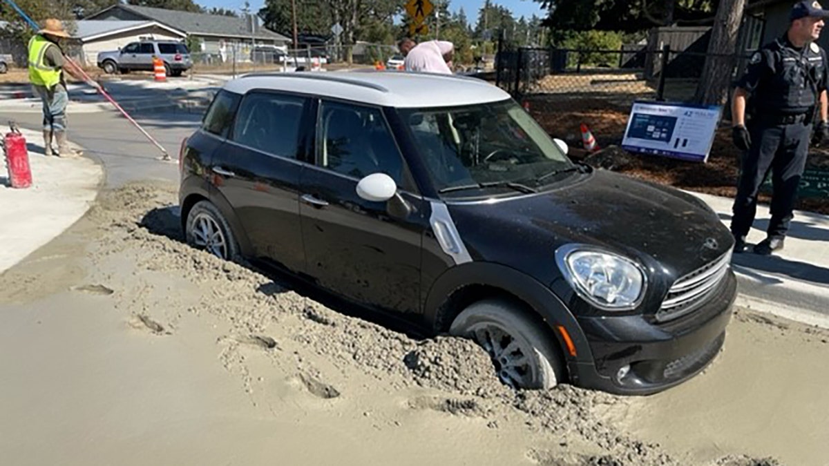 car stuck in wet concrete