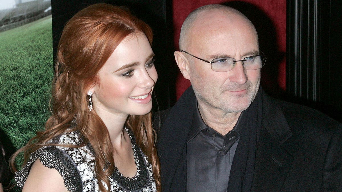 Phil Collins and daughter Lily Collins at "The Blind Side" premiere