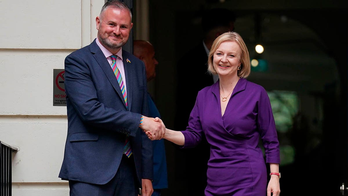 Liz Truss shaking hands with Andy Stephenson